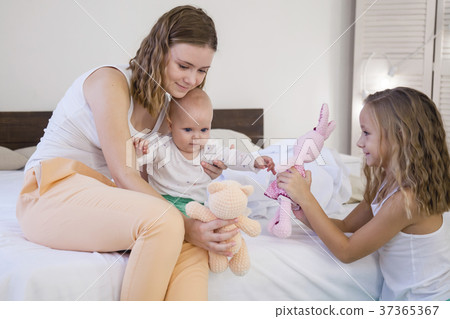 three sisters play children in the morning in the 37365367