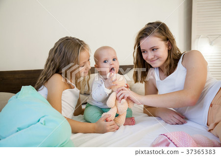 three sisters baby girl children in the morning on 37365383