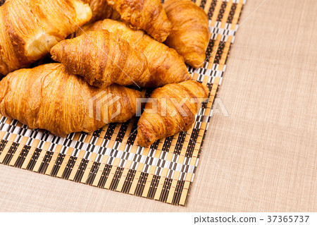 Home made golden croissants on a table 37365737