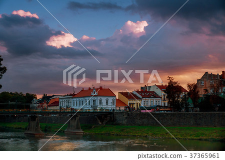 Evening Uzhhorod pedestrian bridge across river Evening Uzhhorod pedestrian bridge across river 37365961
