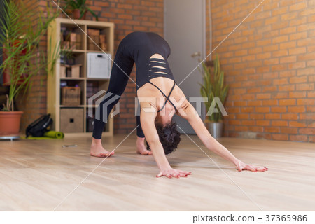 Young Caucasian woman practicing yoga doing Young Caucasian woman practicing yoga doing 37365986