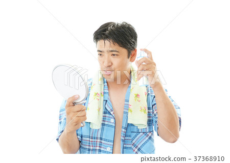 A man doing skin care A man doing skin care 37368910