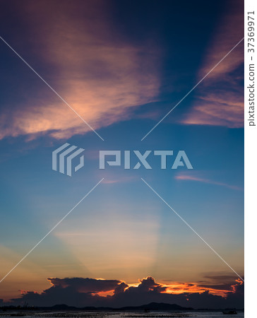 Nice sun ray in twilight sky at sea  37369971
