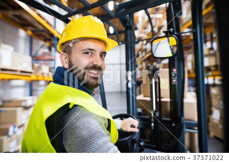 Warehouse man worker with forklift. Warehouse man worker with forklift. 37371022
