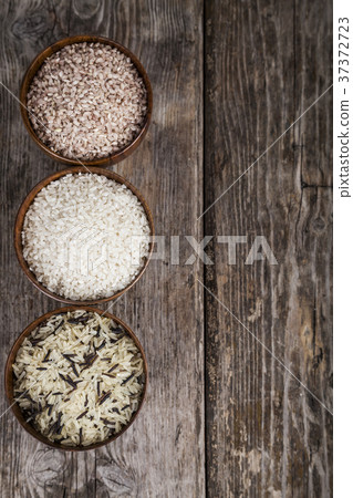 Three bowls with different varieties of rice 37372723