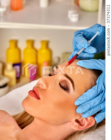 Dermal fillers of woman in spa salon with Dermal fillers of woman in spa salon with 37374311