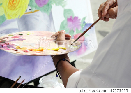 artist painting with water colors 37375925