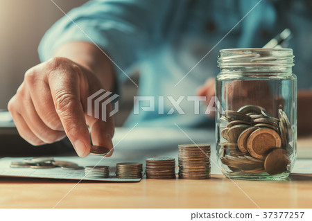 close up hand businessman saving money 37377257