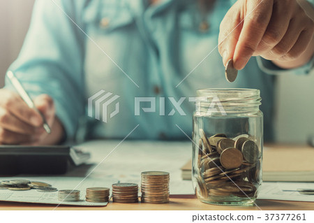 close up hand business women saving money close up hand business women saving money 37377261
