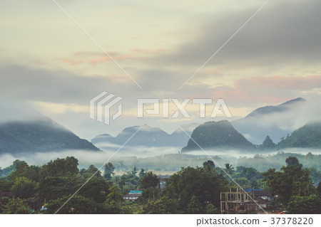 Beautiful sunrise and white mist with mountain Beautiful sunrise and white mist with mountain 37378220