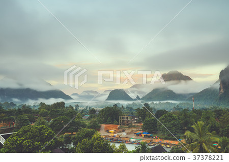Beautiful sunrise and white mist with mountain Beautiful sunrise and white mist with mountain 37378221
