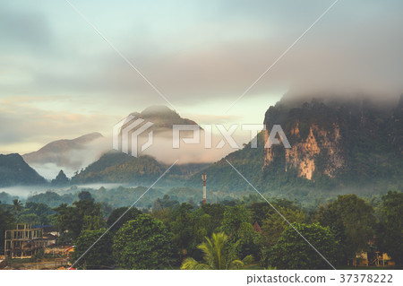 Beautiful sunrise and white mist with mountain Beautiful sunrise and white mist with mountain 37378222