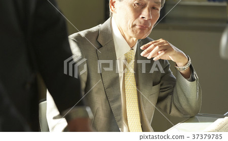 Business man putting personal things together Business man putting personal things together 37379785