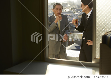 Businessman resting on the roof 37379884