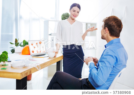 Beautiful young woman standing in front of her 37380908