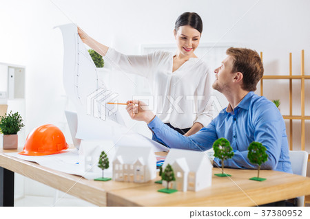 Calm colleagues talking about their new project 37380952