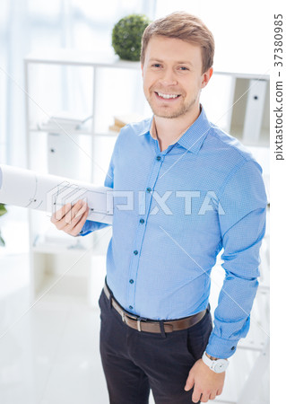 Excited smart engineer smiling happily while being 37380985