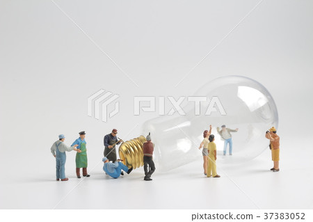 group of figure working on a bulb group of figure working on a bulb 37383052