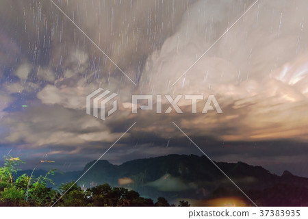 Startrail with Mountain view, foggy environment Startrail with Mountain view, foggy environment 37383935