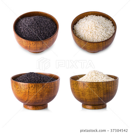 Rice in wooden bowl on white background. Rice in wooden bowl on white background. 37384542