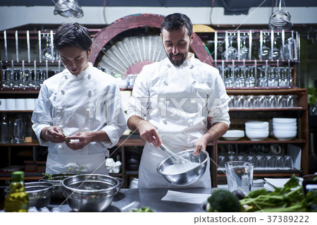 Chef cooking in the kitchen Chef cooking in the kitchen 37389222