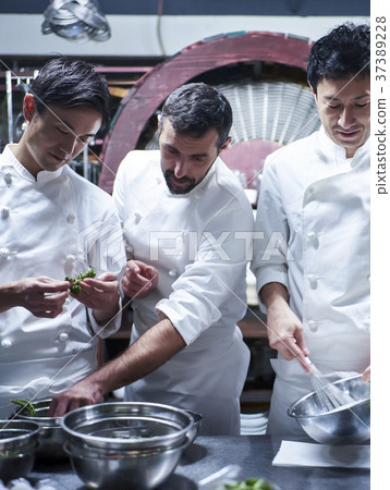 Chef cooking in the kitchen 37389228