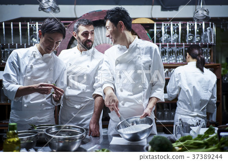 Chef cooking in the kitchen 37389244