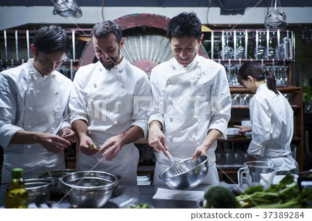 Chef cooking in the kitchen 37389284
