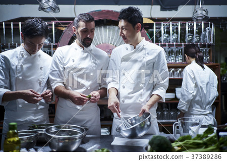 Chef cooking in the kitchen 37389286