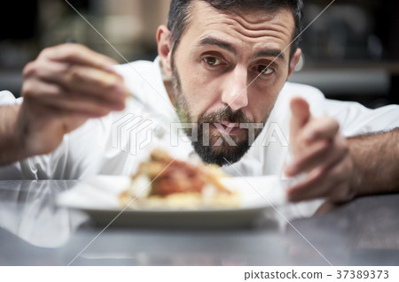 Chef cooking in the kitchen 37389373