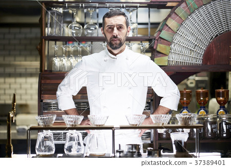 Chef standing in a restaurant Chef standing in a restaurant 37389401