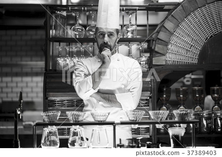 Chef standing in a restaurant 37389403