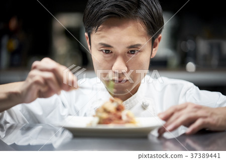 Chef cooking in the kitchen 37389441