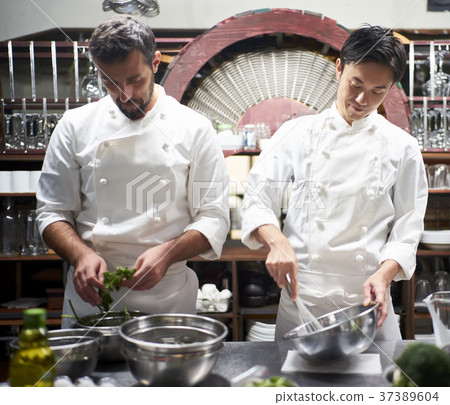Chef cooking in the kitchen 37389604