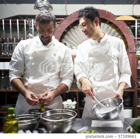 Chef cooking in the kitchen Chef cooking in the kitchen 37389661