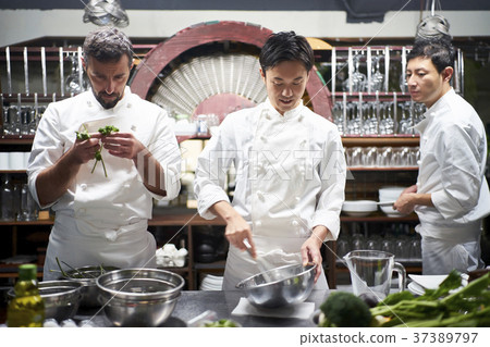 Chef cooking in the kitchen 37389797