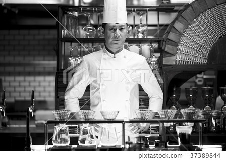 Chef standing in a restaurant 37389844