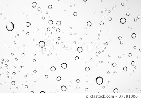 closeup water drops on car glass in rainy season. closeup water drops on car glass in rainy season. 37391006