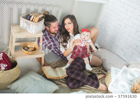 Happy young family mother, father and daughter 37391630