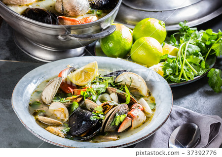 Seafood clams crabs mussela soup. Mariscal 37392776
