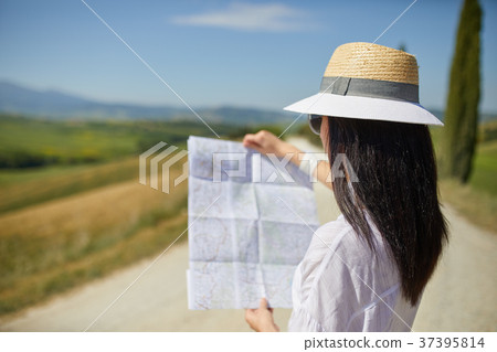woman holding paper map finding right tourist route 37395814