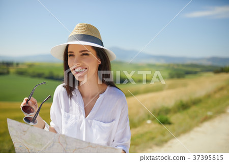 woman holding paper map finding right tourist route 37395815