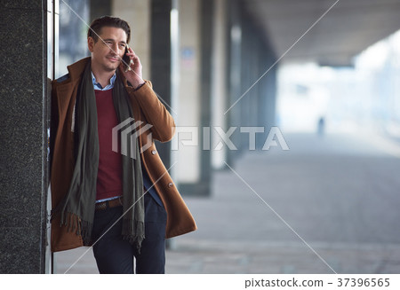 Outgoing male telling by phone 37396565