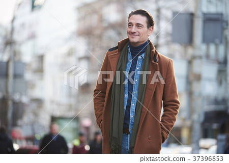 Smiling male walking on street Smiling male walking on street 37396853
