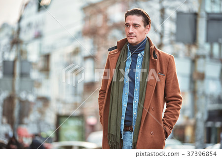 Calm man going outside in cool day Calm man going outside in cool day 37396854