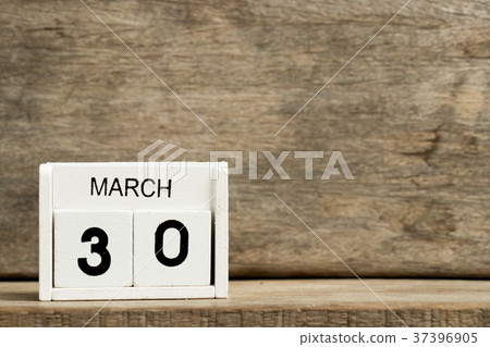White block calendar present date 30 and March 37396905