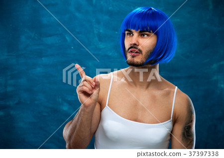 Young male cross dressing person wearing blue wig 37397338