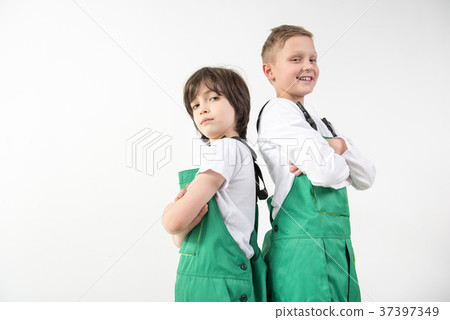Satisfied technicians wearing green coveralls Satisfied technicians wearing green coveralls 37397349