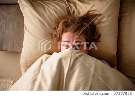Sleepy adult male waking up for work in bedroom 37397938