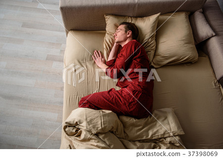 Adult male having nap at home 37398069